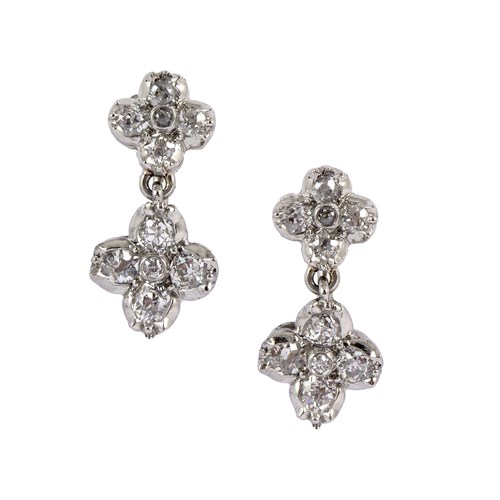 Pair of diamond quatrefoil cluster pendant earrings, early to mid-20th century, with two graduated flowerheads,